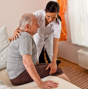 Aid helping with mobility assistance - getting out of bed